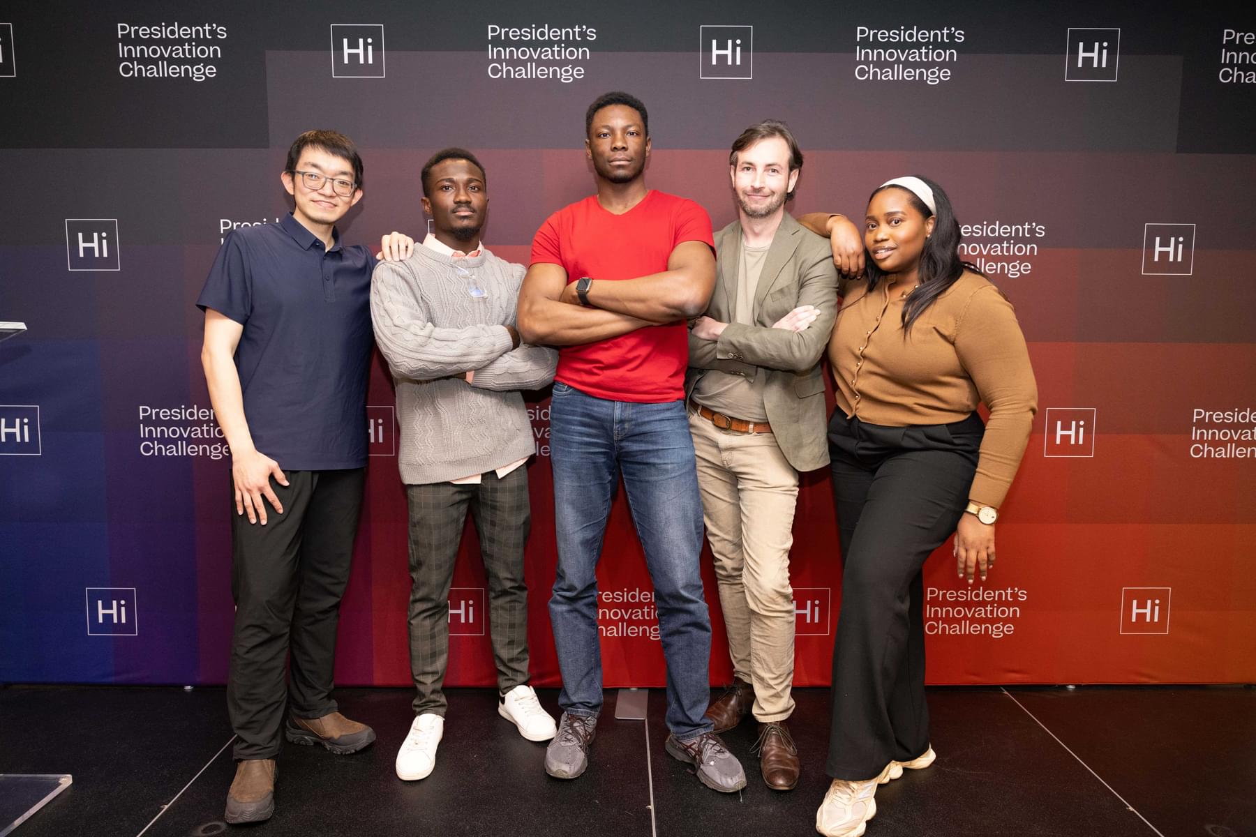 founders pose in front of President's Innovation Challenge backdrop