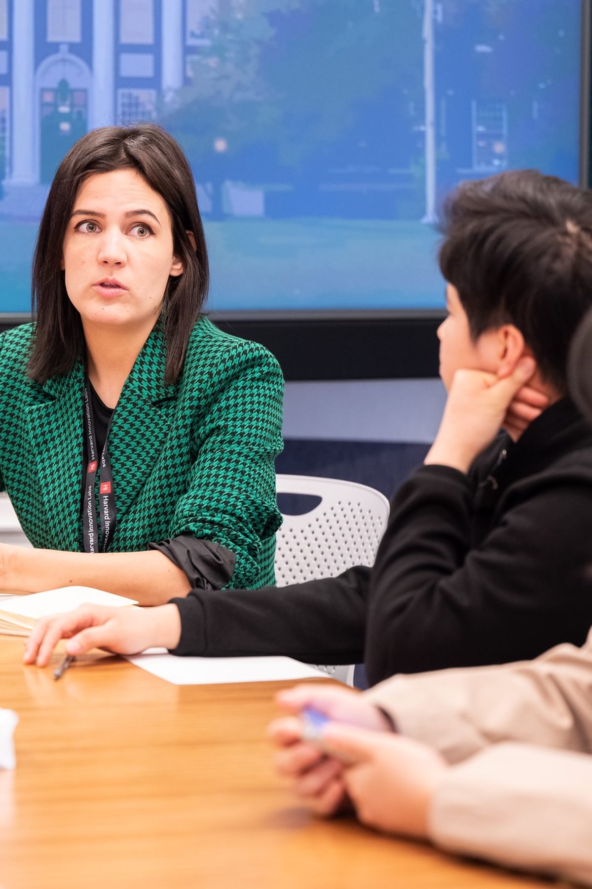 three founders talking in a conference room